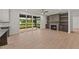 Open living area with a fireplace, built-in shelving, and access to an outdoor deck at 20 Serenity Woods Trl, Franklinton, NC 27525