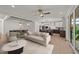 Open-concept living room flows to a dining area and a modern kitchen with stainless steel appliances at 20 Serenity Woods Trl, Franklinton, NC 27525