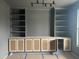 Elegant living room featuring custom built-ins with shelving and cabinetry, perfect for storage and display at 20 Serenity Woods Trl, Franklinton, NC 27525