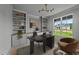Home office with custom built-ins, a view of the outdoors, and ample natural light at 20 Serenity Woods Trl, Franklinton, NC 27525