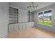 Office with built-in shelving and a view of the front yard at 20 Serenity Woods Trl, Franklinton, NC 27525