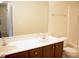 Bright bathroom featuring a double sink vanity with dark wood cabinets and a shower-tub combo at 202 Allen St # A/B, Creedmoor, NC 27522