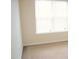 Bright bedroom with neutral carpet and a window providing natural light at 202 Allen St # A/B, Creedmoor, NC 27522