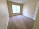 Neutral carpet in this bedroom with a window with blinds at 202 Allen St # A/B, Creedmoor, NC 27522