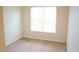 Comfortable bedroom featuring neutral carpet, a window providing natural light, and ample space at 202 Allen St # A/B, Creedmoor, NC 27522