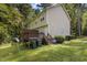 A cozy, two-story home with a wood deck and green lawn backing onto a lush wooded area offers privacy at 202 Allen St # A/B, Creedmoor, NC 27522
