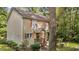 Charming two-story home featuring light siding, brown shutters, covered front porch and mature landscaping at 202 Allen St # A/B, Creedmoor, NC 27522