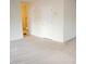 Open living area with neutral carpet, two entry doors and a staircase leading up at 202 Allen St # A/B, Creedmoor, NC 27522