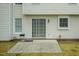 Backyard featuring a grill on a concrete patio with a manicured lawn at 206 Newberry Ln, Durham, NC 27703