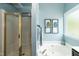 Bathroom featuring a shower and soaking tub with framed art at 206 Newberry Ln, Durham, NC 27703