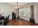 Bright dining room with hardwood floors, a large window, and classic chandelier at 206 Newberry Ln, Durham, NC 27703