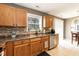 This kitchen features stainless steel appliances, a breakfast nook, and tile floors at 206 Newberry Ln, Durham, NC 27703