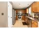 This spacious kitchen features stainless steel appliances, granite counters, tile floors, and wood cabinets at 206 Newberry Ln, Durham, NC 27703