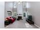 Bright living room with high ceilings, fireplace, and plenty of natural light at 206 Newberry Ln, Durham, NC 27703