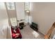 High-ceiling living room featuring a fireplace, large windows, and a ceiling fan at 206 Newberry Ln, Durham, NC 27703
