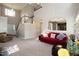 Open-concept living room with high ceilings, fireplace, and seamless flow to other areas at 206 Newberry Ln, Durham, NC 27703