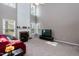 Cozy living room featuring a fireplace, high ceilings, and lots of windows at 206 Newberry Ln, Durham, NC 27703