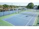 Community tennis and basketball courts near a lake, offering residents a recreational space at 206 Newberry Ln, Durham, NC 27703