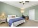 Inviting bedroom features a ceiling fan, bedside table, and comfortable decor at 207 Wildfell Trl, Cary, NC 27513