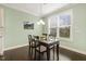 Bright dining nook features natural light and a modern chandelier lighting fixture at 207 Wildfell Trl, Cary, NC 27513