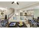 Inviting living room flows into a modern kitchen with a breakfast bar, perfect for entertaining guests at 207 Wildfell Trl, Cary, NC 27513