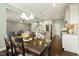 Open floor plan showcases the living area, dining space, and kitchen, perfect for entertaining at 207 Wildfell Trl, Cary, NC 27513