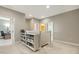 Functional upstairs landing with neutral colors, a display shelf, and access to bedrooms at 207 Wildfell Trl, Cary, NC 27513