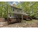 Two-story home featuring a spacious wooden deck for entertaining outdoors at 209 Mill St # A/B, Creedmoor, NC 27522