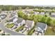 An aerial view captures a neighborhood with manicured lawns, mature trees, and well-maintained homes at 2100 Thornblade Dr, Raleigh, NC 27604