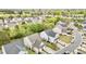 An aerial view of a neighborhood showing two-story homes and tree-lined streets at 2100 Thornblade Dr, Raleigh, NC 27604