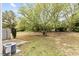 Backyard with mature trees, and patio perfect for outdoor relaxation at 2100 Thornblade Dr, Raleigh, NC 27604