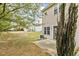 View of the backyard featuring a patio and green space, perfect for outdoor enjoyment at 2100 Thornblade Dr, Raleigh, NC 27604