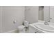 Clean bathroom with a toilet, a sink, a vanity and a shower over bath at 2100 Thornblade Dr, Raleigh, NC 27604