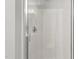 Clean, glass enclosed shower with stainless steel hardware and light fixtures at 2100 Thornblade Dr, Raleigh, NC 27604