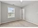 Bright bedroom with a window, carpet flooring, neutral paint and a ceiling fan at 2100 Thornblade Dr, Raleigh, NC 27604