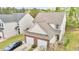 Aerial view of a two-story home featuring a brick-accented garage and neutral siding at 2100 Thornblade Dr, Raleigh, NC 27604