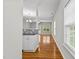Inviting hallway featuring hardwood floors, natural light and leading to the living area at 2100 Thornblade Dr, Raleigh, NC 27604