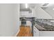 Well-lit kitchen with stainless steel appliances, granite countertops, and a stylish backsplash design at 2100 Thornblade Dr, Raleigh, NC 27604