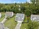 Charming home with manicured front lawn, a two-car garage and mature trees at 2112 Queensway Ct, Creedmoor, NC 27522