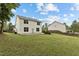 A spacious backyard offers plenty of room for outdoor activities at 2112 Queensway Ct, Creedmoor, NC 27522