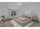 Serene bedroom with a tufted bed, natural light, and neutral tones creating a relaxing atmosphere at 2112 Queensway Ct, Creedmoor, NC 27522