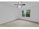 A clean, empty bedroom with neutral carpet and a ceiling fan at 2112 Queensway Ct, Creedmoor, NC 27522