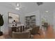 Well-lit home office space with a large desk, decorative shelves, and inviting decor at 2112 Queensway Ct, Creedmoor, NC 27522