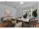 Bright home office with a large window, comfortable seating, and stylish decor at 2112 Queensway Ct, Creedmoor, NC 27522