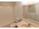 A tiled bathroom features a tub and shower combination and a vanity sink at 212 Blueridge Rd, Carrboro, NC 27510