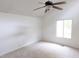 Vaulted bedroom with a ceiling fan and large windows providing ample natural light at 212 Blueridge Rd, Carrboro, NC 27510