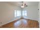 Bright and airy bedroom with hardwood floors and a ceiling fan at 212 Blueridge Rd, Carrboro, NC 27510