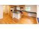 Spacious kitchen with hardwood floors, an island, and light wood cabinets at 212 Blueridge Rd, Carrboro, NC 27510