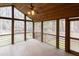 Enclosed porch with wood ceiling and view of a tree filled yard at 212 Blueridge Rd, Carrboro, NC 27510