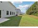 Home's backyard with a concrete patio and green grass at 2207 Cherry Creek Rd, Haw River, NC 27258